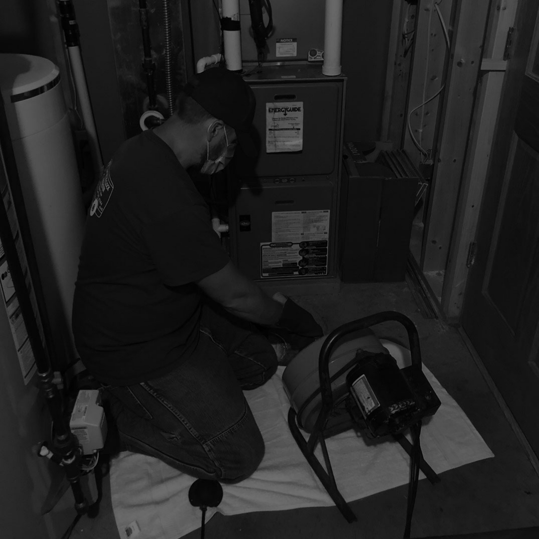 Image of plumber performing Drain Clog Repair