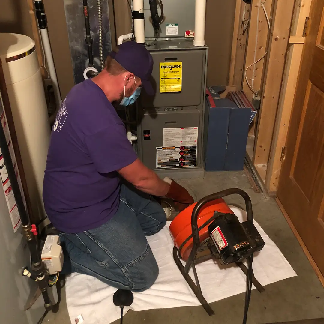 Image of plumber performing Drain Clog Repair